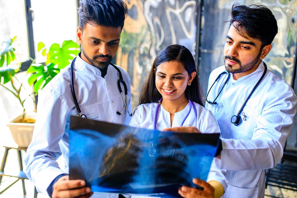 Indian medical residents reviewing an X-ray